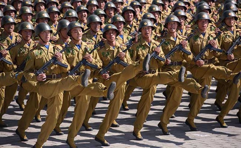 After a 21-gun salute, dozens of infantry units marched through Kim Il Sung Square, some in night-vision goggles or wielding rocket-propelled grenade launchers (AFP)