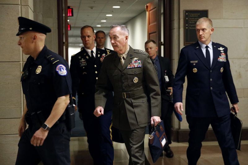 Joint Chiefs Chairman Gen. Joseph Dunford, center, walks to a classified briefing for members of the U.S. Senate on Iran, Tuesday, May 21, 2019, on Capitol Hill in Washington. (AP Photo/Patrick Semansky)