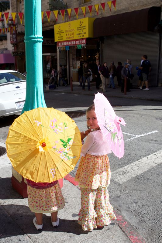 Young girls standing at a street corner in San Francisco's China Town