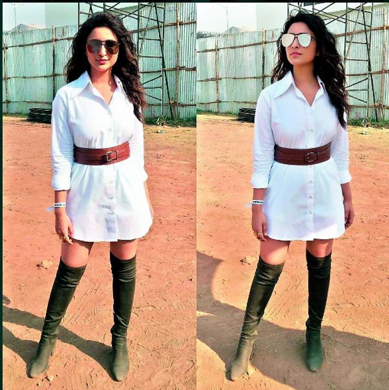 A big and white cotton shirt can be worn as a dress. Style it with a sleek belt, just like Parineeti did
