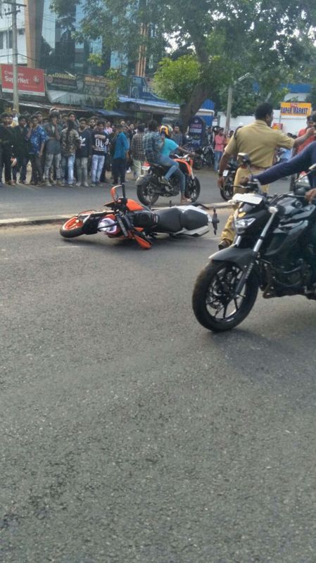 A bike which fell down during the stunt on main road