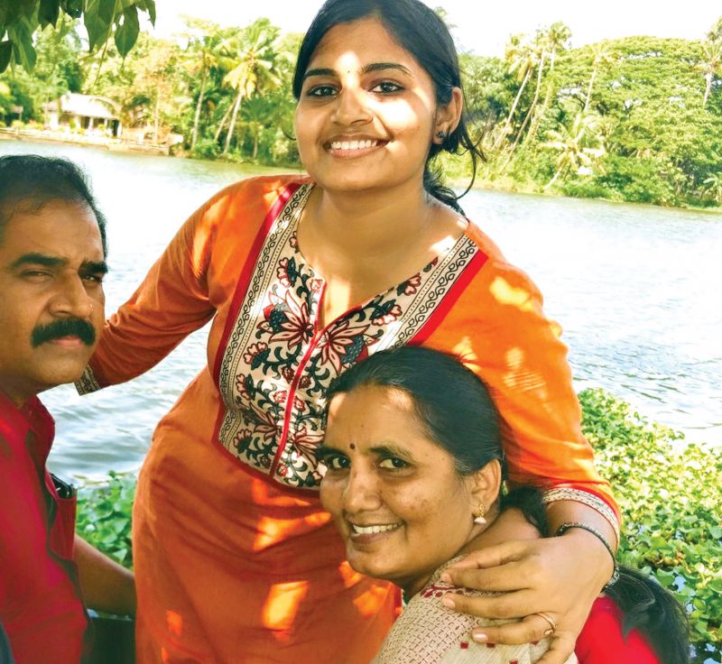 Kanmani with her parents.
