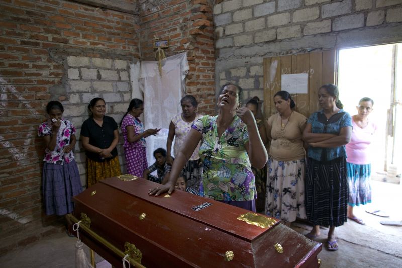 Lalitha, center, weeps standing beside the coffin with the remains of 12-year old niece, Sneha Savindi, who was a victim of Easter Sunday bombing at St. Sebastian Church, in Negombo, Sri Lanka. (Photo:AP)
