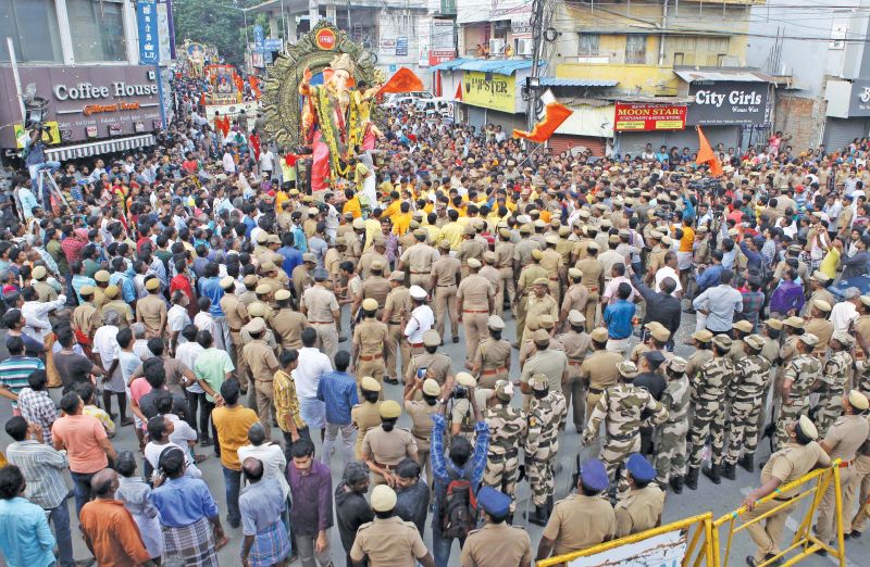 A group of New College Students, Royapettah  garlanded Lord Vinayaga idol kept opposite Royapettah Government hospital Mortuary on Sunday. In an effort to promote communal harmony the  students took part in the puja before the idol was taken for immersion. Senior police officials and local residents also took part in the programme.(Photo: DC)