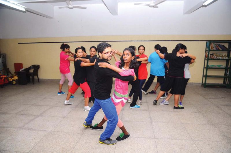 Rajesh Raj  with his students at the Latin dance classes