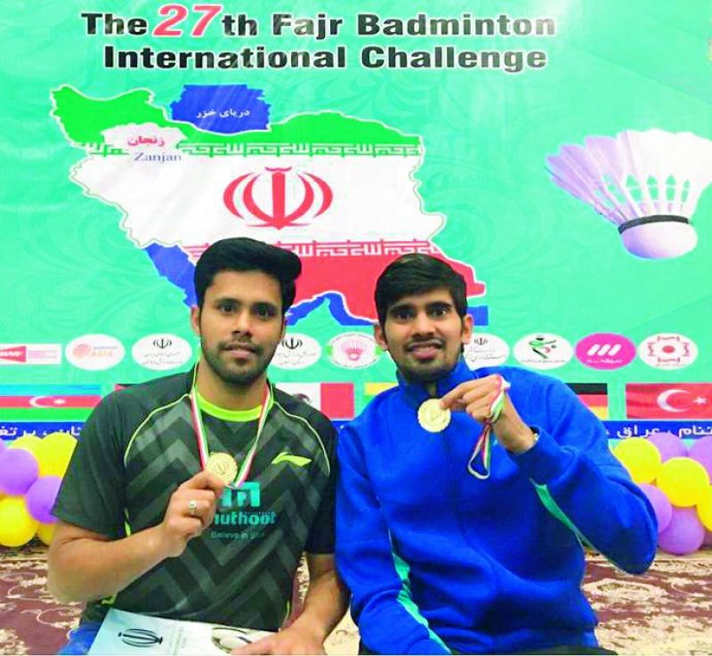 Alwin Francis (left) and Nandagopal Kidambi pose with their medals after winning the Iran Challenger.