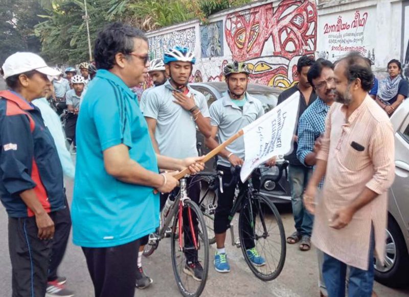 State police chief Loknath Behera flags off a cycle rally as part of the Laurie Baker birth centenary celebration at Manaveeyam Veedhi in Thiruvananthapuram on Saturday.