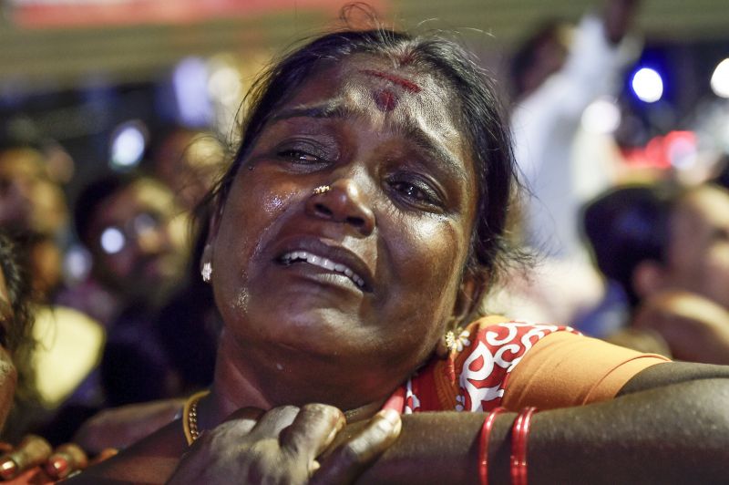 A Dravida Munnetra Kazhagam (DMK) supporters reacts a bulletin was released about party president M Karunanidhi's health, in Chennai on Monday. (Photo: PTI)