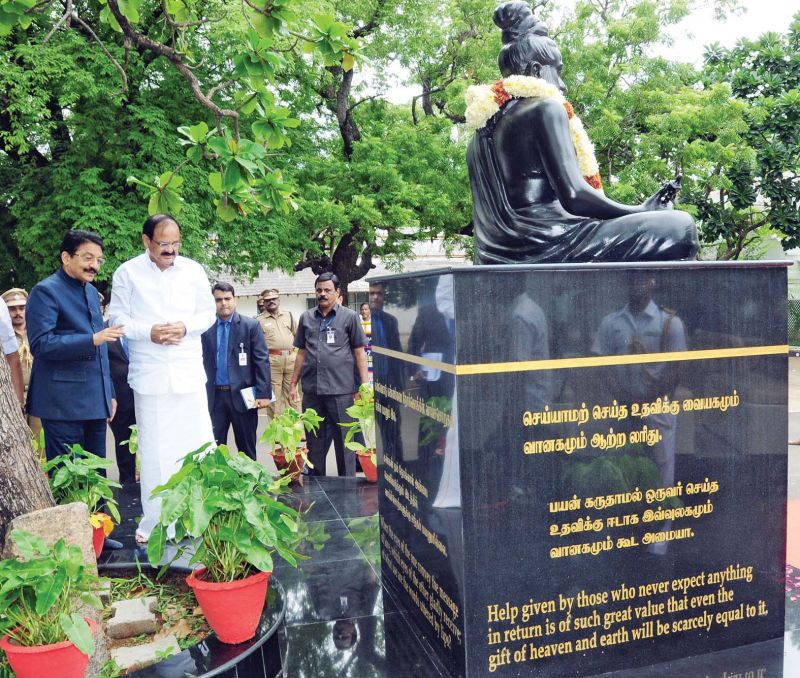 Vice President Venkaiah Naidu admires the recently unveiled statue of Tiruvalluvar at the Raj Bhavan, Chennai, on Sunday with Governor Ch. Vidyasagar Rao (Photo: DC)