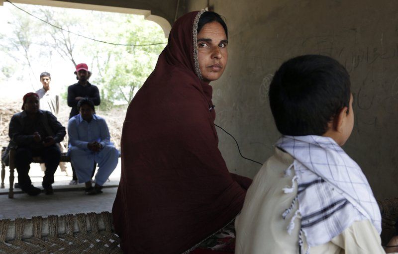 Kausar Parveen sits with her son who was allegedly raped by a mullah or religious cleric, in Kehror Pakka, Pakistan on May 4. (Photo: AP)