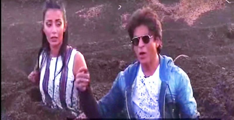 As part of the prank, Shah Rukh fell into a mud pit along with the female host of the show. 