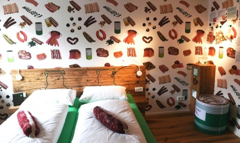 The sausage-themed hotel has opened in Germany to help keep the village butcher's shop alive. (Photo: AFP)