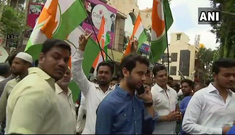 Congress workers celebrate outside counting centre in Bengaluru after party candidate Sowmya Reddy leads over BJP's BN Prahlad in Jayanagar assembly constituency. (Photo: ANI/Twitter)