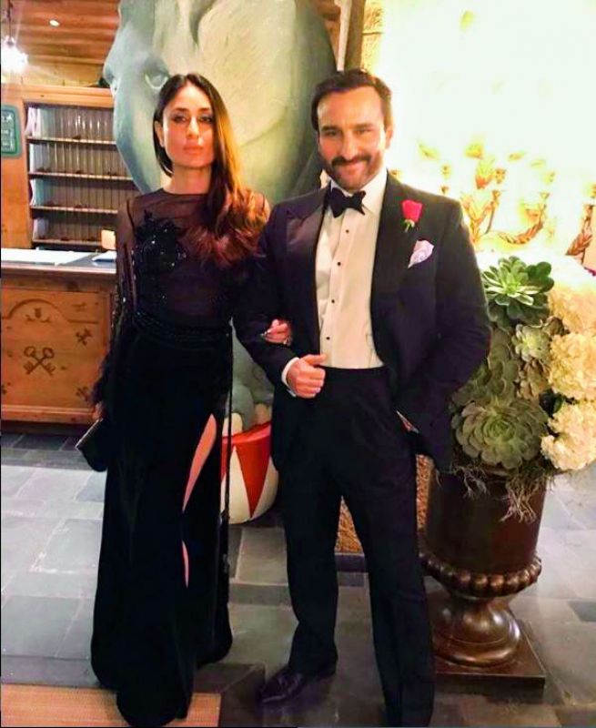 Manish Malhotra captioned this photogprah: The Gorgeous Royal couple #dapper #saifalikhan and the #Beautiful #kareenakapoorkhan in Black #Bespoke #manishmalhotralabel