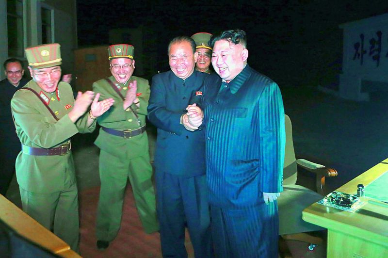 North Korean leader Kim Jong-Un celebrates the test launch (Photo: AFP)