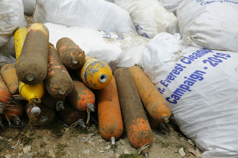 Food wrappers, cans, broken tents, bottles and empty oxygen cylinders were found among the garbage. (Photo: AP)