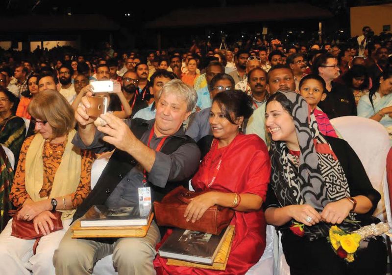 IFFK Jury chair Michel Khleifi with jury members Seema Biswas and Baran Kosari clicks a selfie against the packed Nisagandhi auditorium during the concluding ceremomy of the 21st IFFK in Thiruvananthapuram on Friday.	(Photo: A.V.MUZAFAR)
