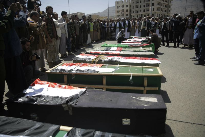 Mourners attend a mass funeral of victims of an explosion during a funeral procession in Sanaa, Yemen.