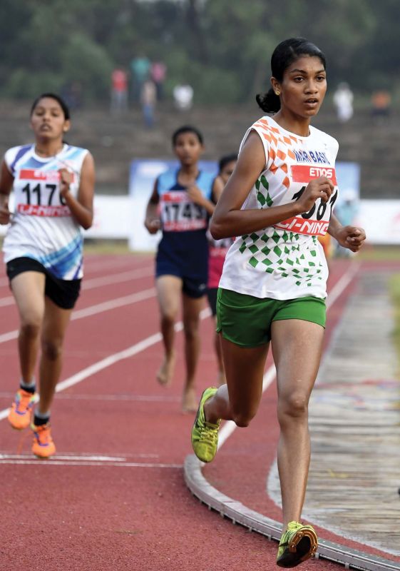 Anumol Thampi sets meet record in the 5000 m senior girls' category in the state school athletic championship at Thenhipalam on Sunday. 