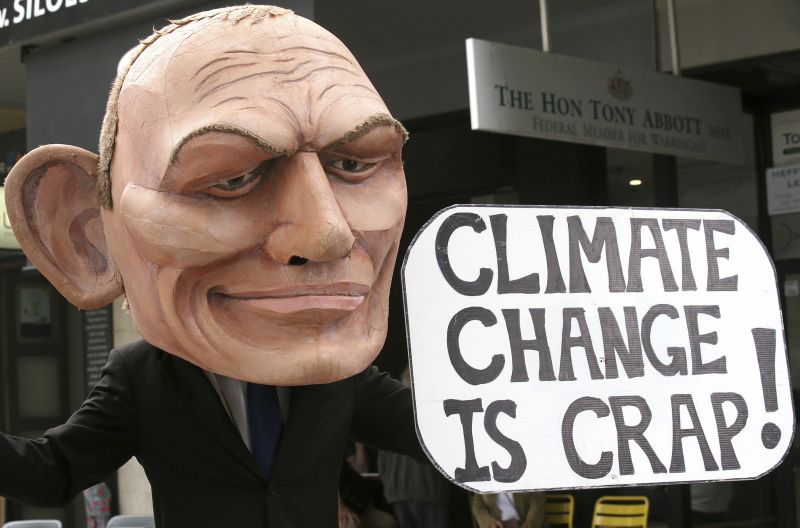 In this May 3, 2019, file photo, a demonstrator with a giant head in the likeness of former Australian Prime Minister Tony Abbott holds a sign referencing a comment by Abbott made in 2017 belittling the science of climate change, during a student organized protest at in Sydney. Australian elections is held on Saturday, May 18, 2019. (Photo:AP)