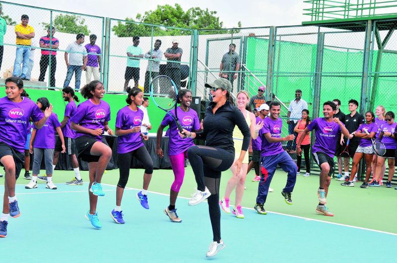 Tennis kids are delighted as Sania joins them in a jig at the SMTA in Hyderabad.