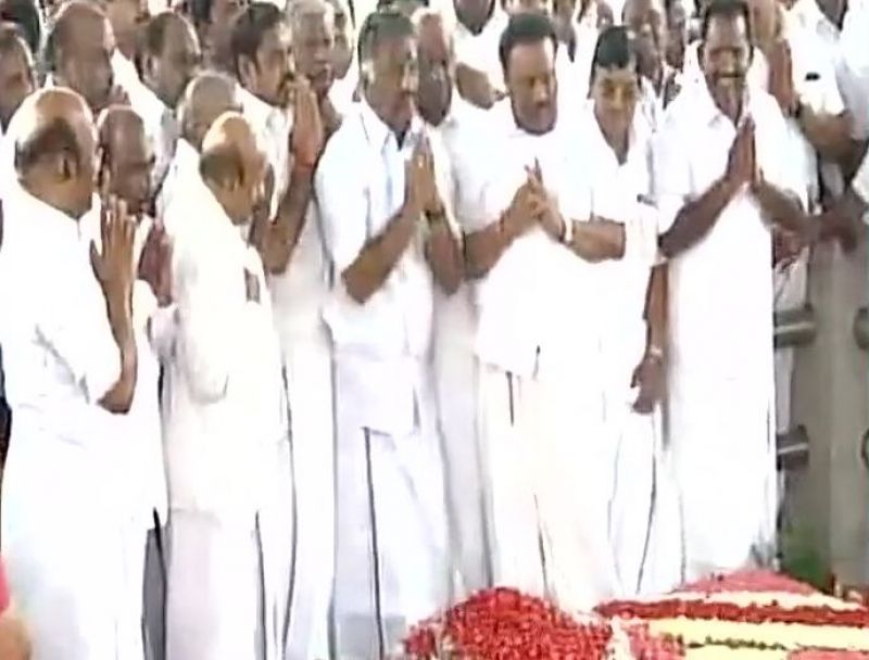 CM E Palanisamy and  O Panneerselvam pay tributes to former CM Jayalalithaa's at her Marina Beach memorial. (Photo: ANI | Twitter)