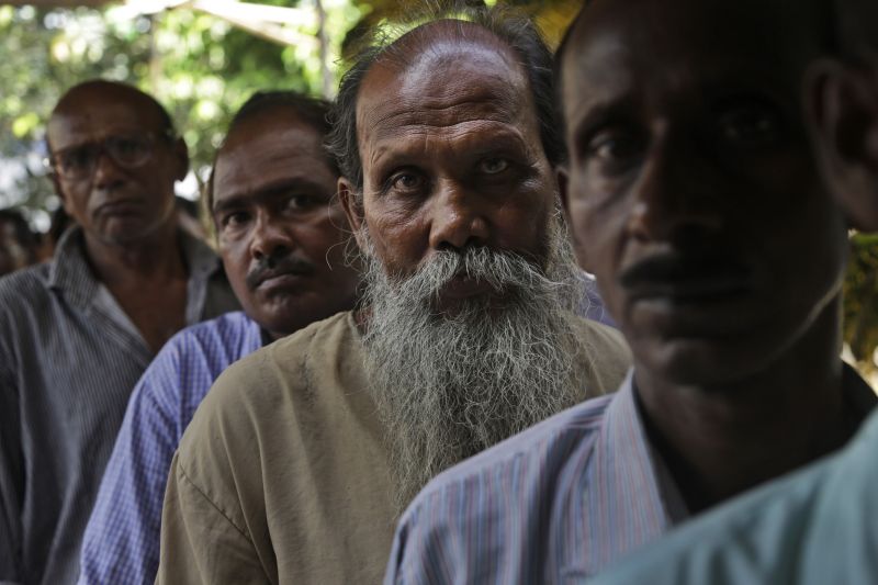 Indian men stand in queue to cast their votes at a polling booth in Bardhaman east constituency, West Bengal state, India, Monday, April 29, 2019. With 900 million of India's 1.3 billion people registered to vote, the Indian national election is the world's largest democratic exercise. (Photo:AP)