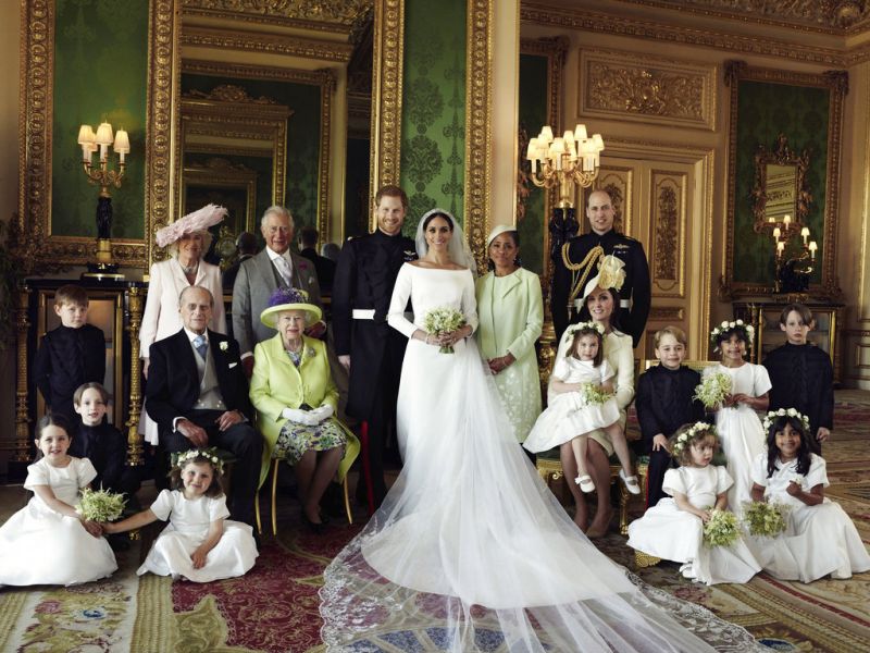 In this photo released by Kensington Palace on Monday May 21, 2018, shows an official wedding photo of Britain's Prince Harry and Meghan Markle, center, in Windsor Castle, Windsor, England, Saturday May 19, 2018. Others in photo from left, back row, Jasper Dyer, Camilla, Duchess of Cornwall, Prince Charles, Doria Ragland, Prince William; center row, Brian Mulroney, Prince Philip, Queen Elizabeth II, Kate, Duchess of Cambridge, Princess Charlotte, Prince George, Rylan Litt, John Mulroney; front row, Ivy Mulroney, Florence van Cutsem, Zalie Warren, Remi Litt. (Photo: AP)