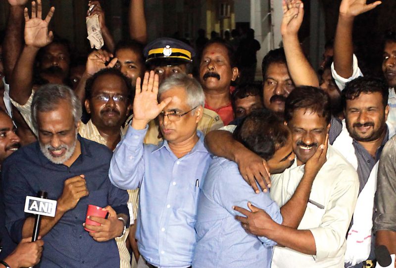 Udayabhanu (extreme left) and Sohan (second from left) after Sreejith's family ended stir on Sunday night. 