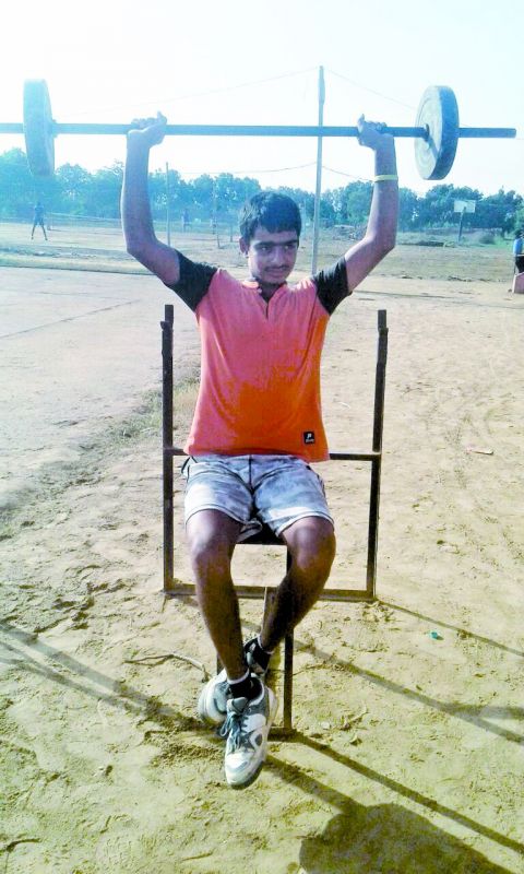 Ajay Malik, the tennis under-14 champion, training at the gym and court built in a field in Haryana by his father Ajmer Malik, an army man and a former national-level wrestler