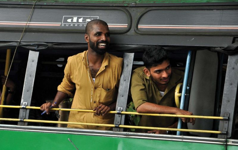 The bus crew watches the cultural rally being taken out by the members of the transgender community as in Kozhikode on Monday.