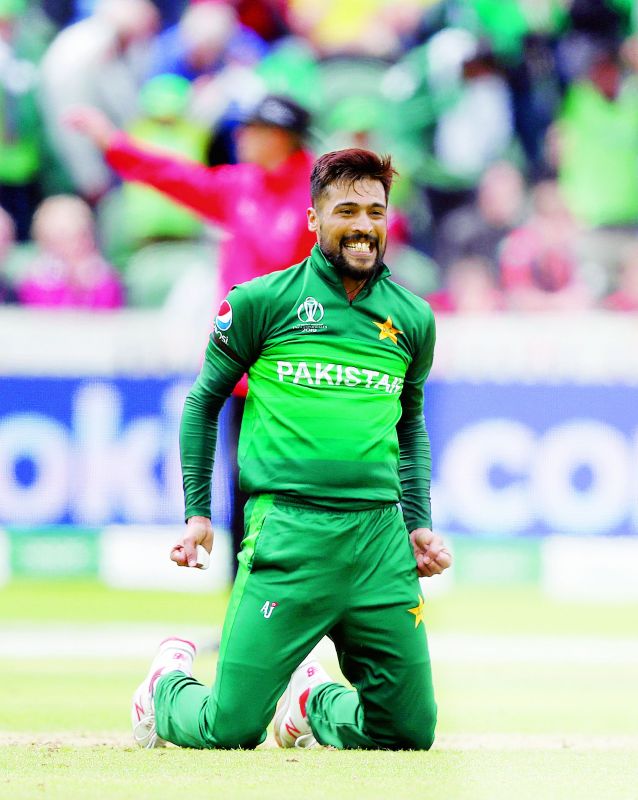 Pakistan pacer Mohammad Amir celebrates taking the wicket of Mitchell Starc during the match against Australia at the County Ground in Taunton on Wednesday. (Photo: AP)
