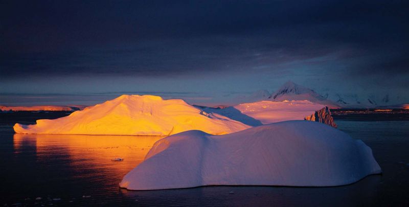 Golden light on iceberg