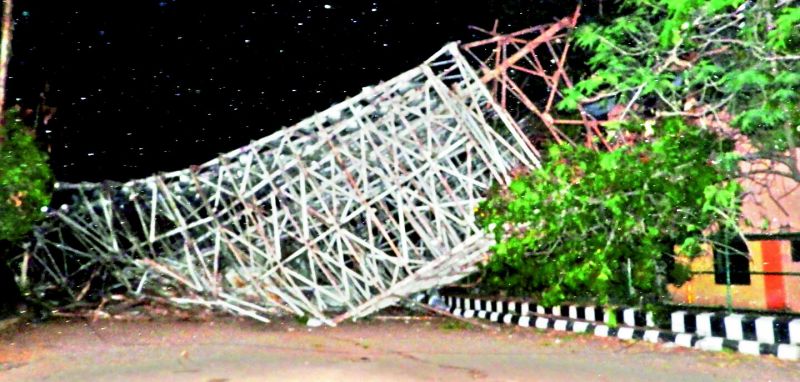 The 70-metre-tall floodlight tower that collapsed killing one and injuring another. 
