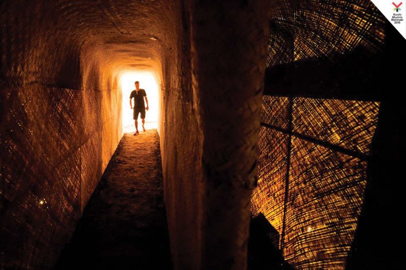 A visitor inside Ales Steger's  The Pyramid of Exiled Poets'