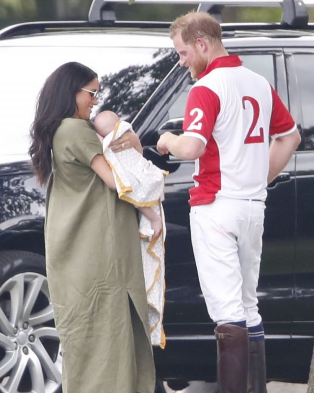 Prince Harry seen affectionately patting his son, as Meghan holds the baby. (Photo: Instagram)