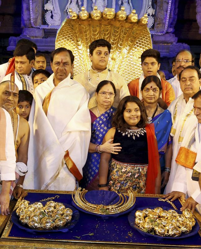 Telangana CM K Chandrasekhar Rao with his family members before donating ornaments worth Rs 5 crore at the golden holy flag mast of the temple of Lord Venkateswara at Tirumala in Tirupati. (Photo: PTI)