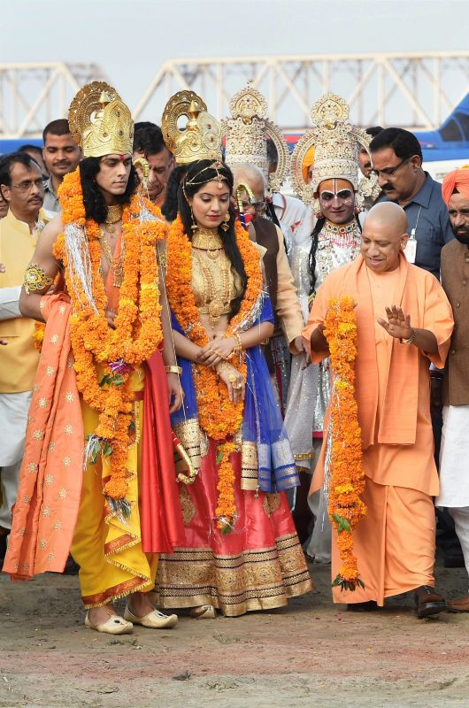 Uttar Pradesh Chief Minister Yogi Adityanath welcoming the artistes dressed up as Lord Rama and Sita during Deepotsav celebrations in Ayodhya on Wednesday. (Photo: PTI)