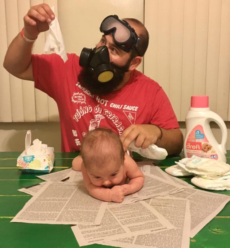 Gas mask and newspapers, essential for nappy time (Photo: Facebook)