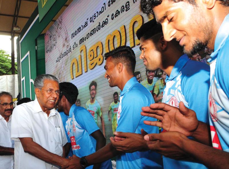 Chief minister Pinarayi Vijayan and transport minister A.K. Saseendran meet players of the victorious Kerala football team. (Photo: A.V. Muzafar & ARUN CHANDRABOSE)