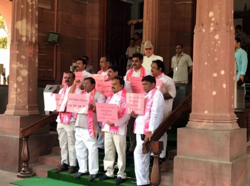 TRS protest outside Parliament carrying placards saying 'One nation, One law'. (Photo: ANI |Twitter)