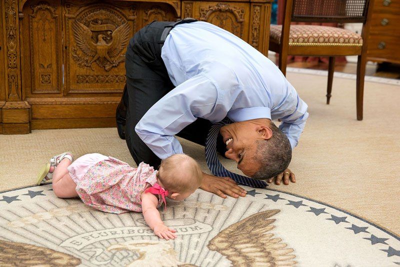 Barack Obama plays with a child. (Photo: Official White House Photo by Pete Souza)