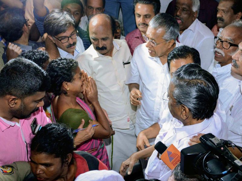  Kerala Chief Minister Pinarayi Vijayan meets the flood-affected people at a Munderi camp in Wayanad on Saturday. (Photo: PTI)