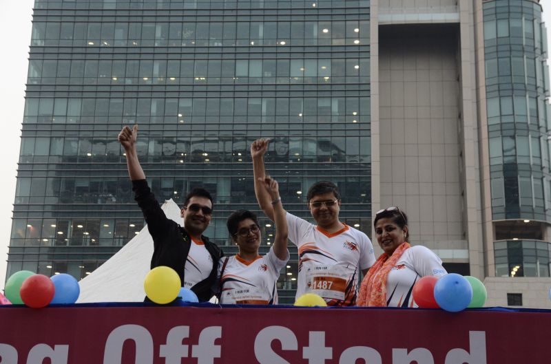 L TO R Amit Mookim, General Manager, India and South Asia, IQVIA and Sangeeta Barde, Co-founder ORDI cheering the crowd at Race for 7 - A run to spread awareness on rare diseases.
