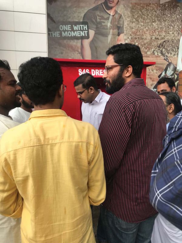 Director of Employment and Training Dr Sriram Venkataraman interacts with the members of Aashrayam' in front of the cloth box installed at Keston Road in Thiruvananthapuram.