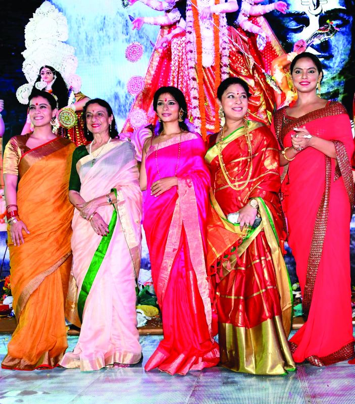 Like goddess Durga who stands alone, separated from her consort Shiva, a woman is capable of having her own identity; (above) Actress Kajol, Tanuja Mukherjee, Tanish Mukherjee, Sharbani Mukherjee and Neetu Chandra during Durga Pooja (file photo)
