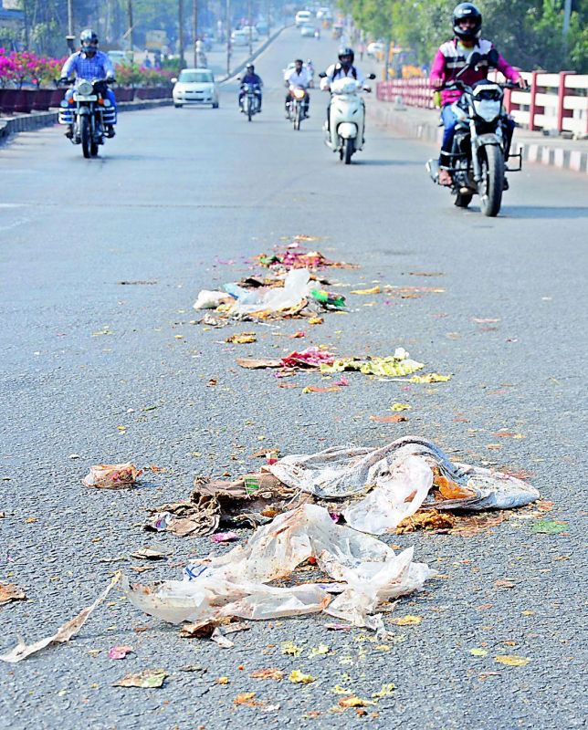 Garbage from one of the vehicles transporting it to a dump yard lies strewn on the road at Lalapet on Thursday. Motorists travelling the route had to put up with the stench and traffic was disturbed.  (Photo: DC)