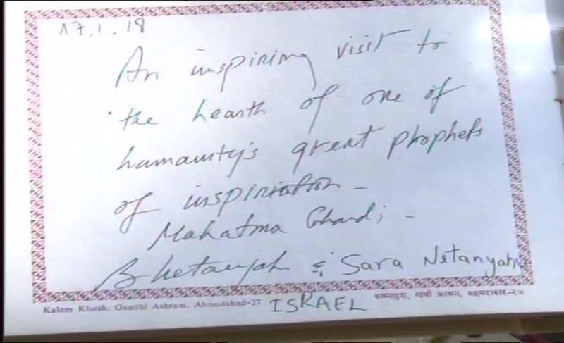 Israeli Prime Minister Benjamin Netanyahu and his wife Sara wrote a message at Sabarmati Ashram. (Photo: ANI)
