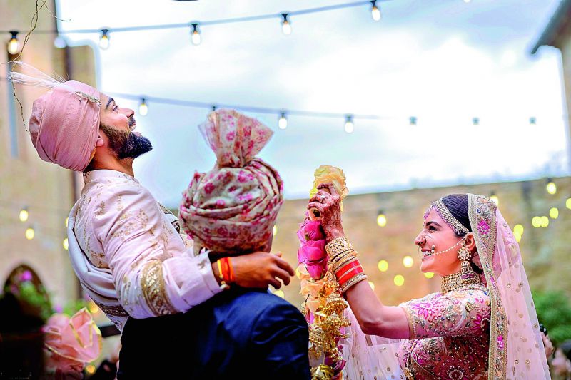 Cricket captain Virat Kohli with his actress wife Anushka Sharma exchange garlands during their wedding in Milan, Italy on Monday. 