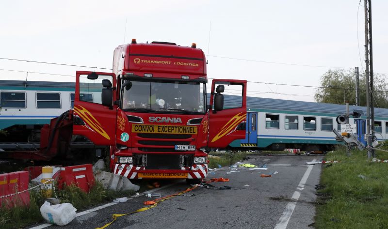 The wreckage of a truck sits next to a railroad crossing where it was hit by a regional train. (Photo: AP)